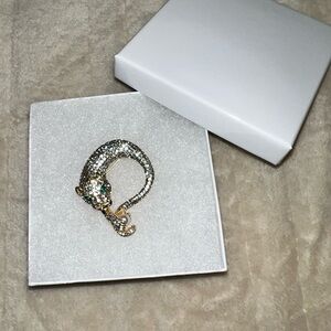 Elegant Gold Panther Brooch with emerald green eyes holding a pearl!